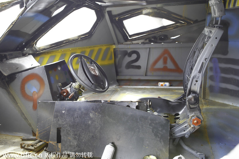 Batman fan opens door to his Batmobile