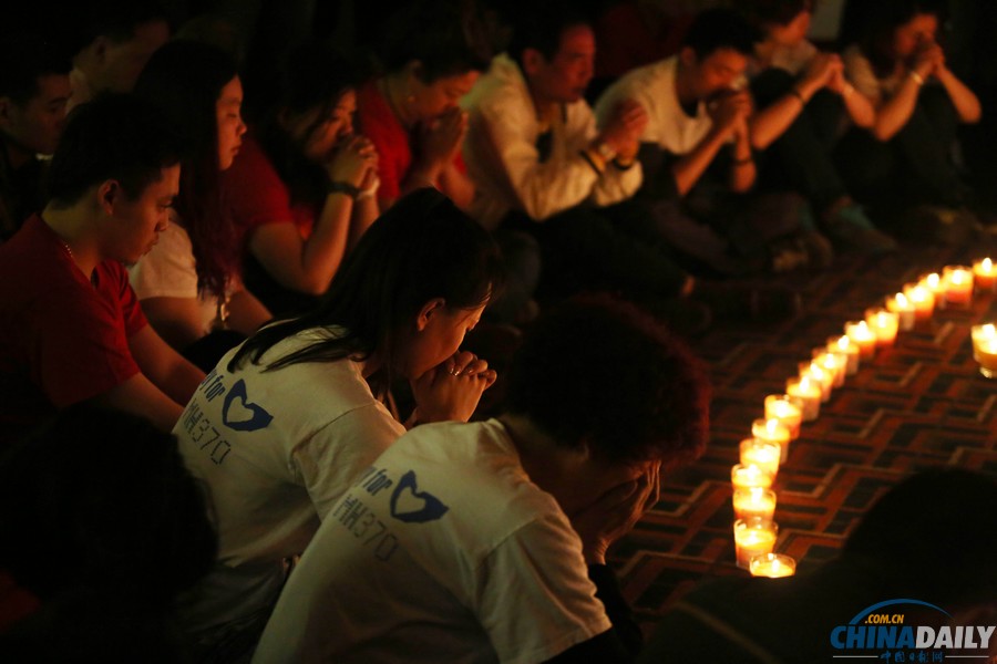 馬航MH370失聯(lián)客機整月 家屬為親人祈福守望