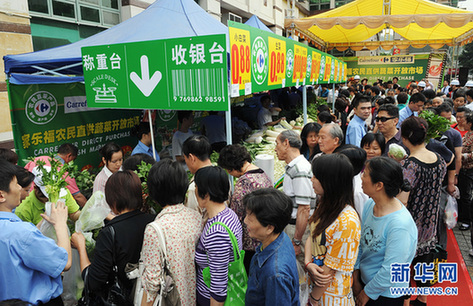 全國各地農超對接救助“賣難”菜農