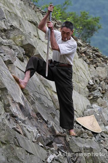 Villagers rebuild sole road after flood