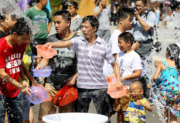 Participants in the annual water festival in Kaili, Guizhou province, enjoy splashing each other on Wednesday. Water Festival in SW China