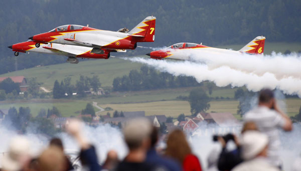 Members of the Spanish aerobatic team Patrulla Aguila perform during the AirPower 13 air show at the Hinterstoisser air base in Zeltweg June 28, 2013. Austrian air show opens