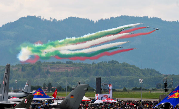 Members of the Italian aerobatic team Frecce Tricolori perform during the AirPower 13 air show at the Hinterstoisser air base in Zeltweg June 28, 2013. Austrian air show opens