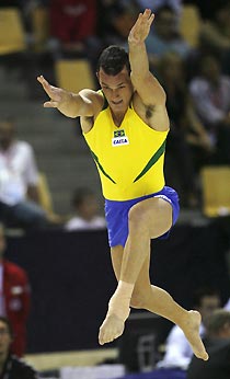 World champion Diego Hypolito from Brazil competes in the floor exercise at the Artistic Gymnastics World Championships in Aarhus, Denmark October 15, 2006.