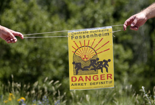 Demonstrators take part in human chain during a protest to ask for the closure of the nuclear power plant of Fessenheim, in Fessenheim, France, June 26, 2011. Protesters demand French nuclear plant closure