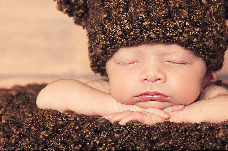 Sleeping newborns photographed in adorable poses